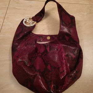A snake skin michael kors bag